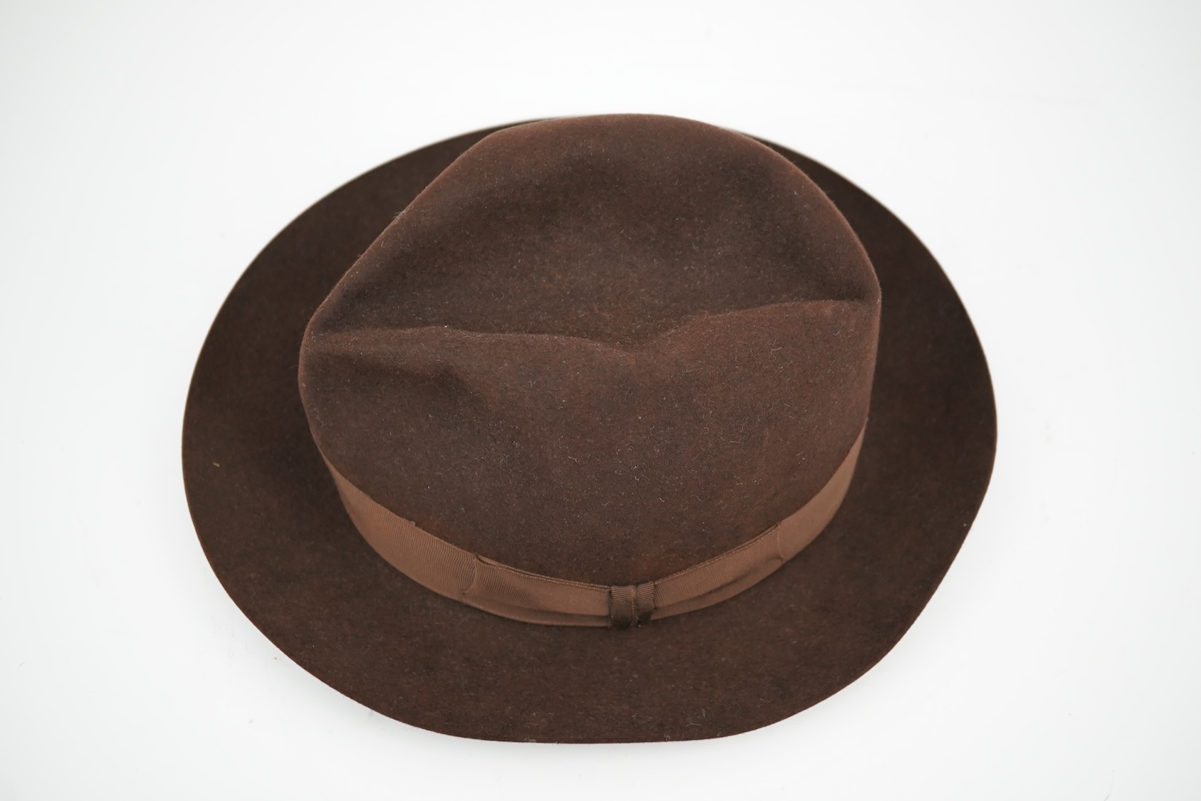 A brown felt Dunn and Co hat Size 56